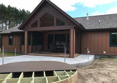 rustic home outdoor construction A M Construct Inc. in West Bend, WI